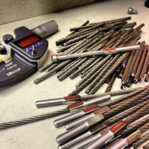 Building custom cable assemblies for use in aircraft. Fittings and swage dies all manufactured in house.